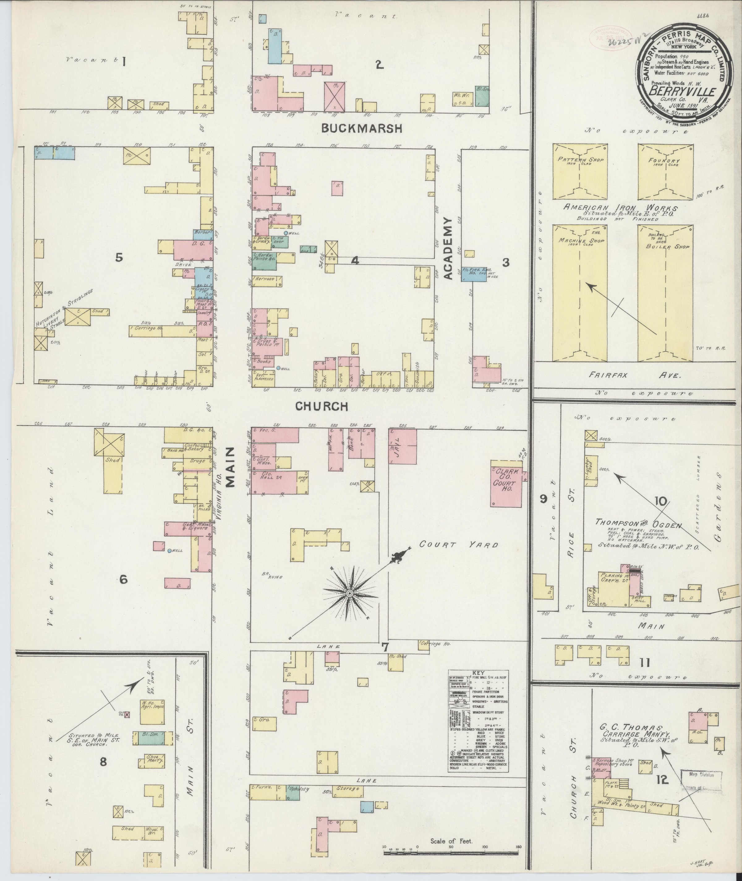 A color fire insurance map sheet of Berryville, Virginia, dated June 1891. Twelve numbered blocks show building footprints tinted yellow for frame, pink for brick and blue for stone, with Buckmarsh, Academy, Church and Main lettered along the streets between them. The Clarke County court house, the jail and a court yard with a compass rose sit near the center. Outlying blocks carry the American Iron Works, Thompson and Ogden's planing mill and G. C. Thomas's carriage manufactory. A printed key and a scale bar of fifty feet to an inch sit at the lower right, and the title block at the upper right gives the population as 990.