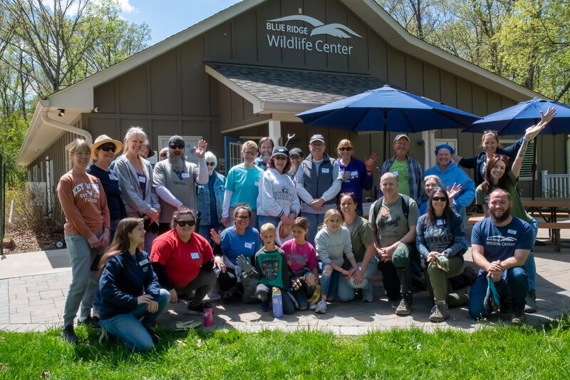 A community group photograph at the Blue Ridge Wildlife Center.