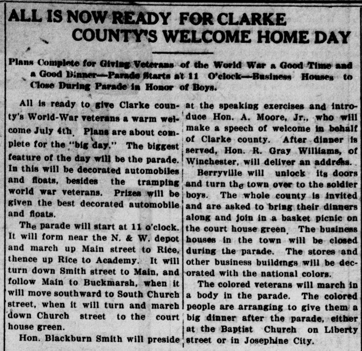 A newspaper column headed "ALL IS NOW READY FOR CLARKE COUNTY'S WELCOME HOME DAY," giving the parade route and time, the speakers, the basket picnic on the court house green, and the plan for the colored veterans to march in a body and be given a dinner afterward.