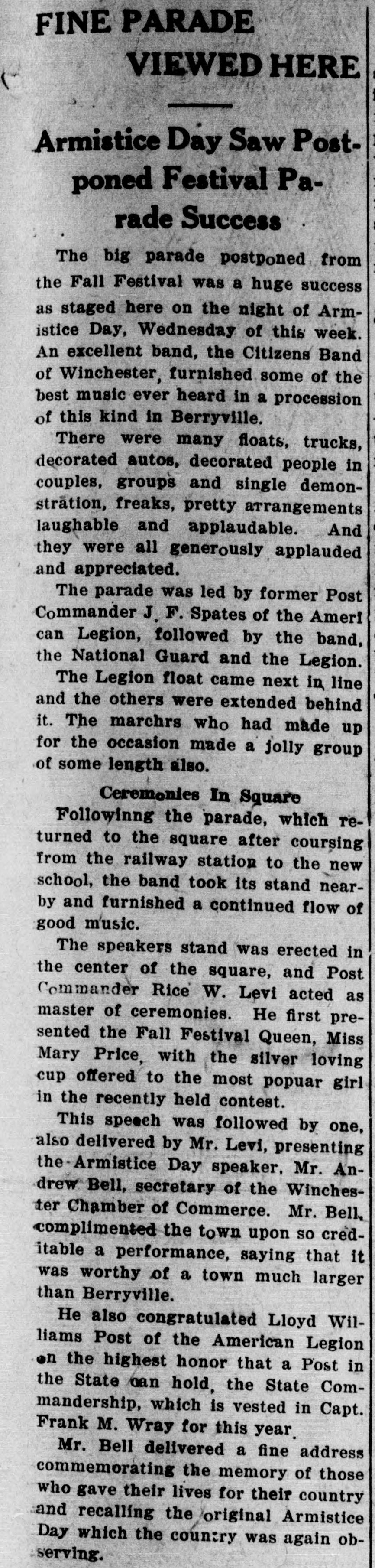 A long newspaper column headed "FINE PARADE VIEWED HERE" with the deck "Armistice Day Saw Postponed Festival Parade Success," describing the band, floats, decorated cars and the ceremonies in the square.