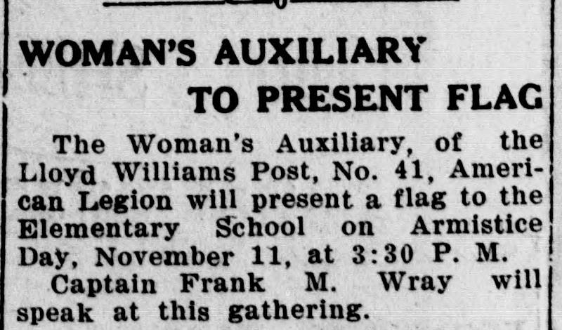 A short newspaper item headed "WOMAN'S AUXILIARY TO PRESENT FLAG," announcing that the Auxiliary of the Lloyd Williams Post would present a flag to the Elementary School on Armistice Day at 3:30 p.m., with Captain Frank M. Wray to speak.